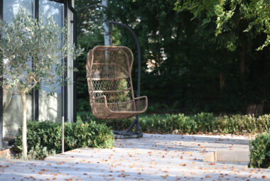 autumn garden deck with a swing chair