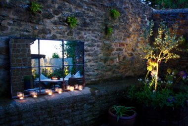 small courtyard garden with outdoor mirror and garden light in Oxfordshire by garden design team
