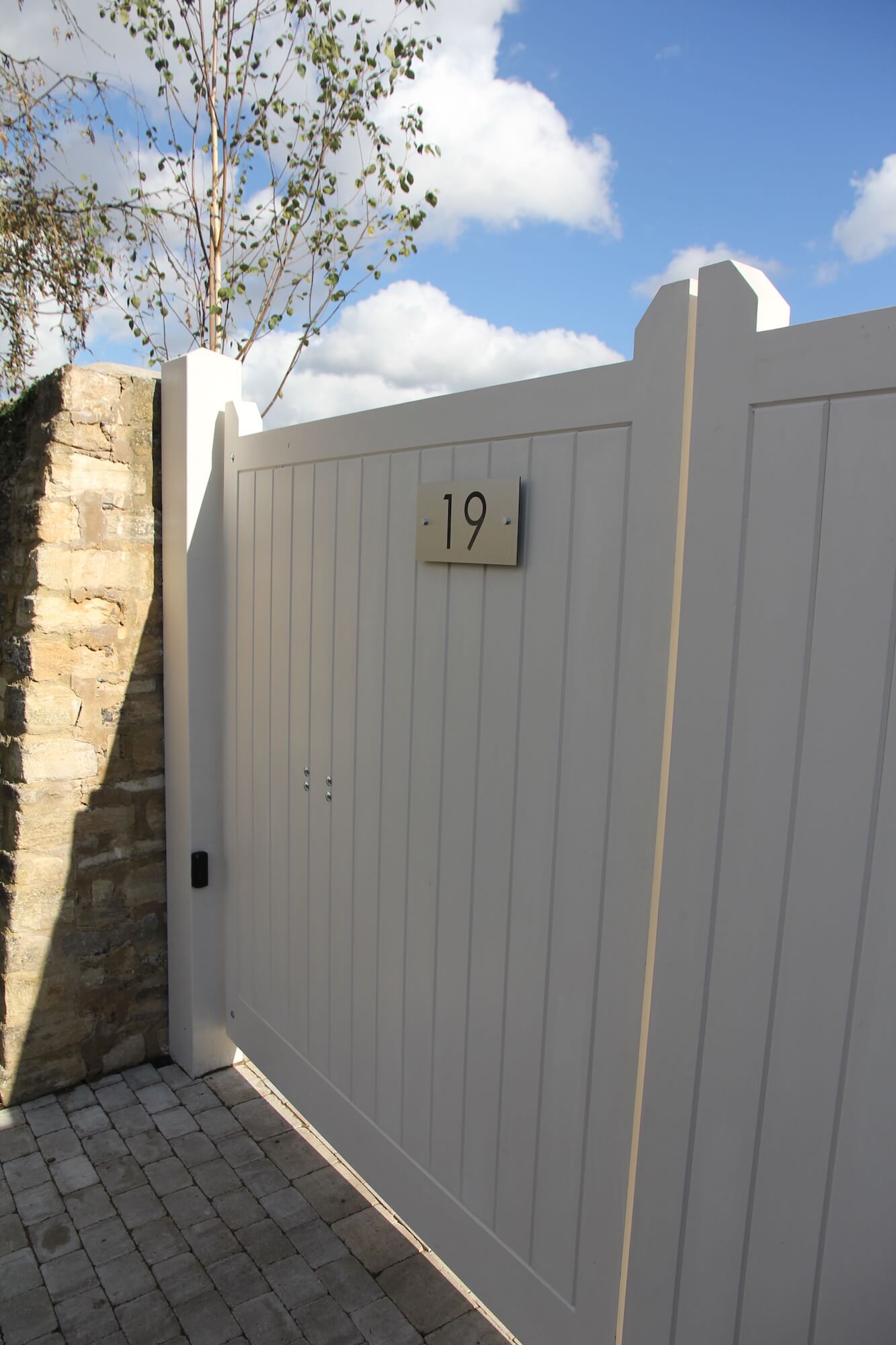 auto gates outside a townhouse painted in farrow & ball