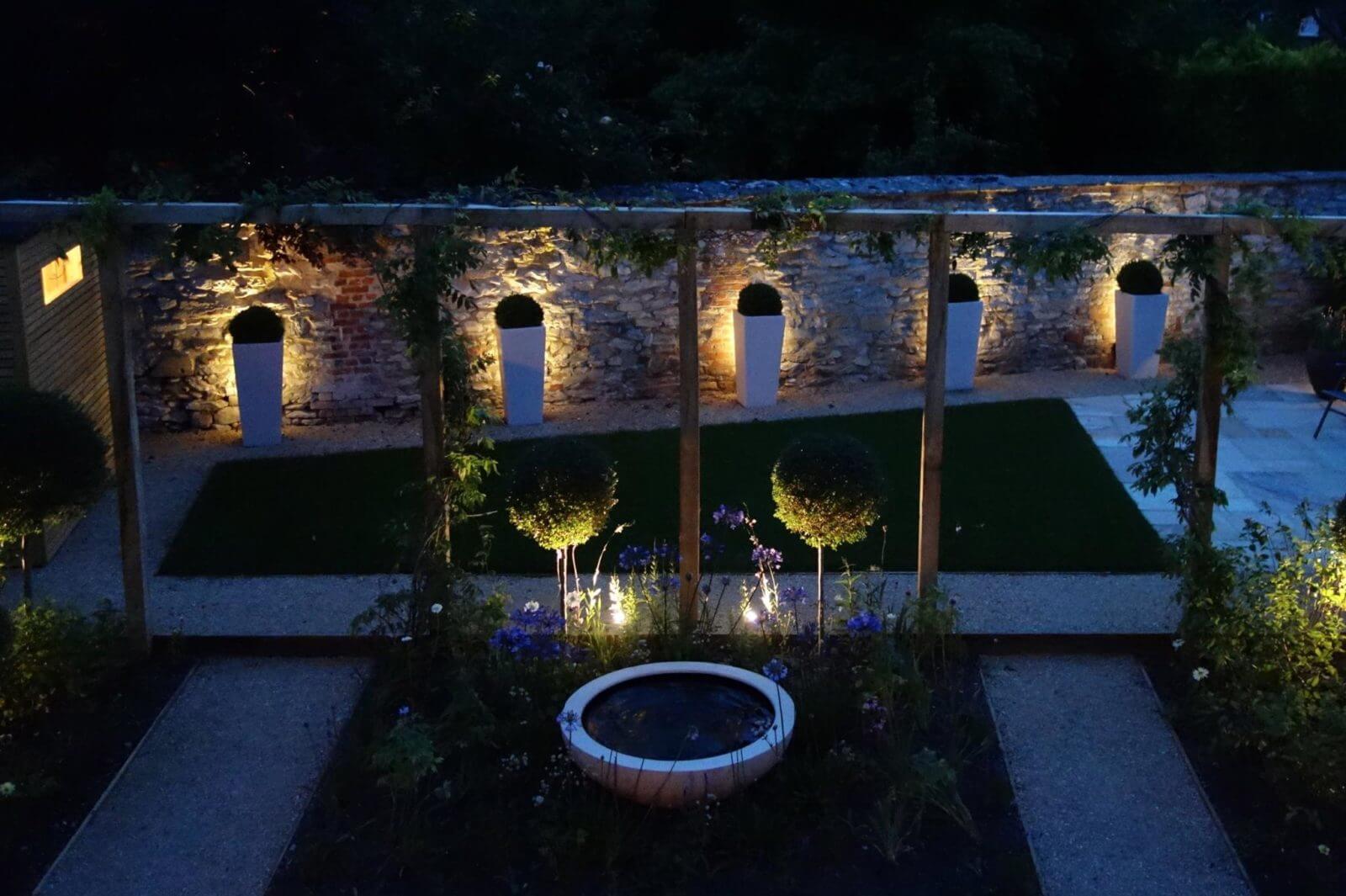 a Oxford garden with lighting at night