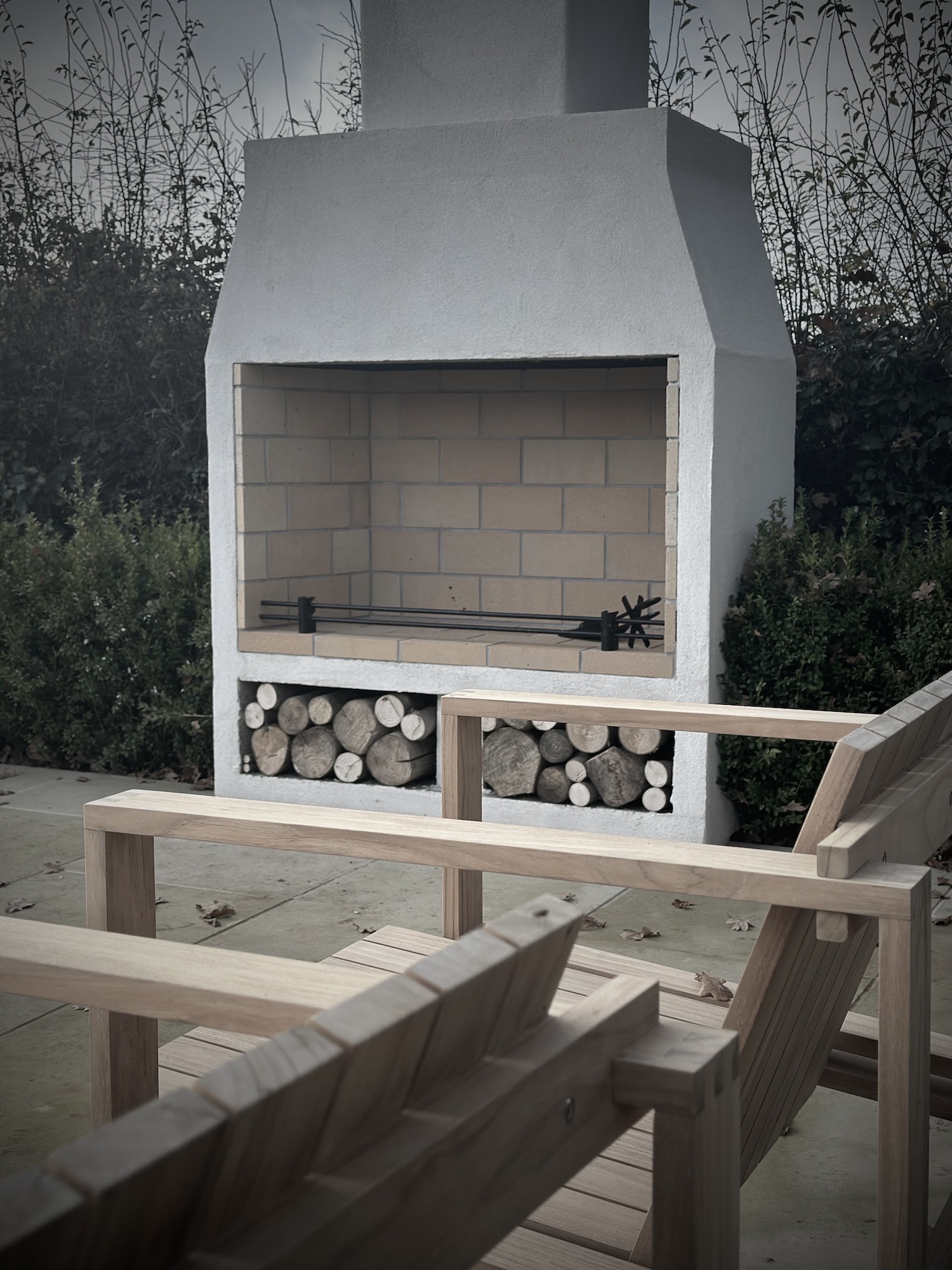 outdoor fireplace in a scandi inspired cotswold garden design